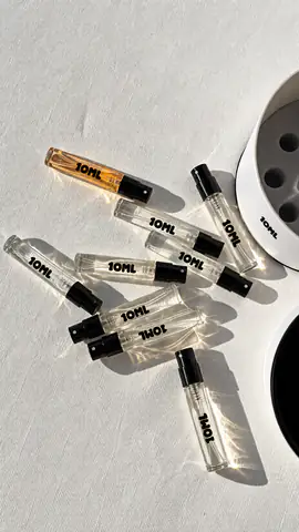 10ML sample vials scattered in sunlight beside their open holder